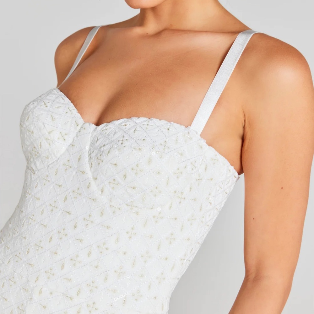 Never been worn!!!!! 
NADINE MERABI Cream Boot Cut Jumpsuit